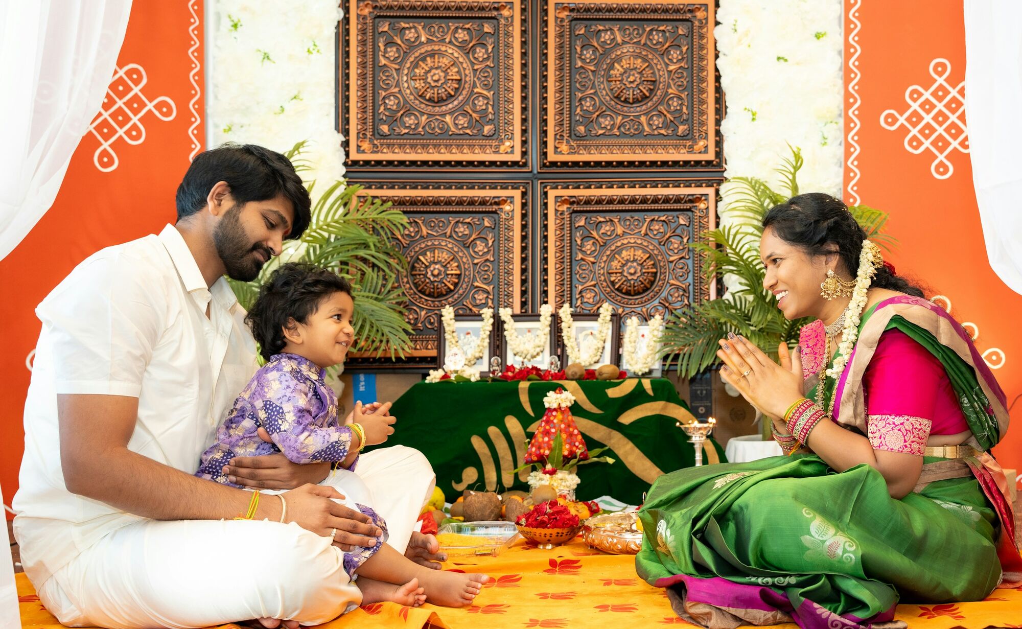 A family together at a home puja
